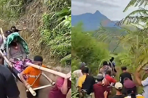 Warga Desa Salumakki, Mamuju, tandu pasien sejauh 28 km karena jalan rusak. Infrastruktur buruk jadi sorotan.