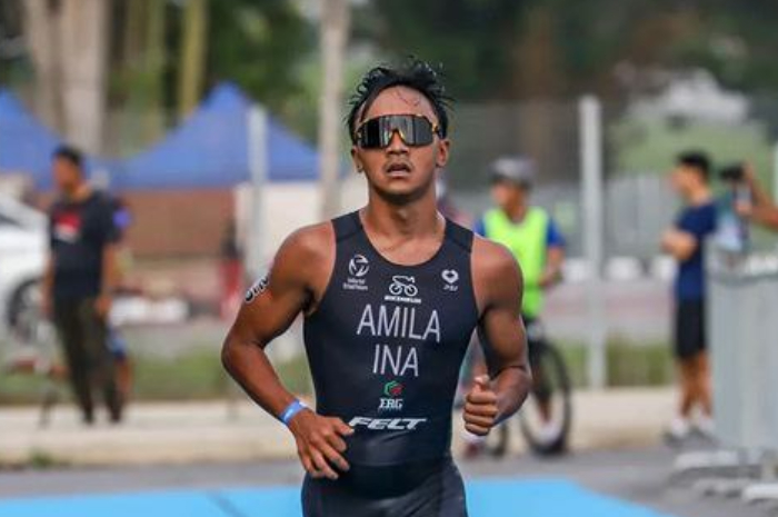 <p>Ket. Foto: Rashif Amila Yaqin atlet triathlon Indonesia, yang meraih medali emas di SEA Games 2023 (Foto/Instagram/@amilaaa.rashif)</p>
