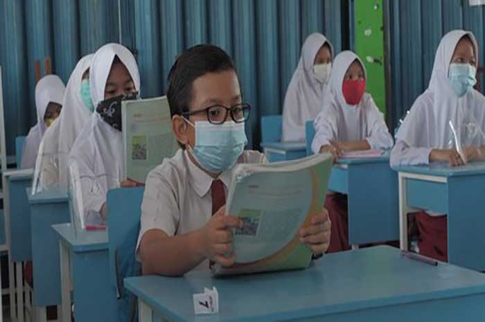 <p>Foto: Illustrasi PTM terbatas di sekolah.</p>
